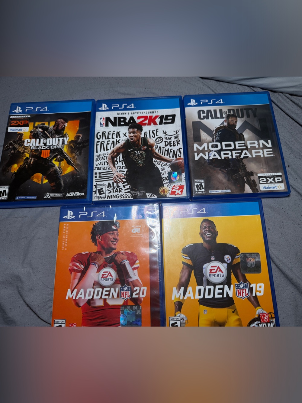 Sony PS4 Game Set with Blue Cases Featuring Sports and Shooters